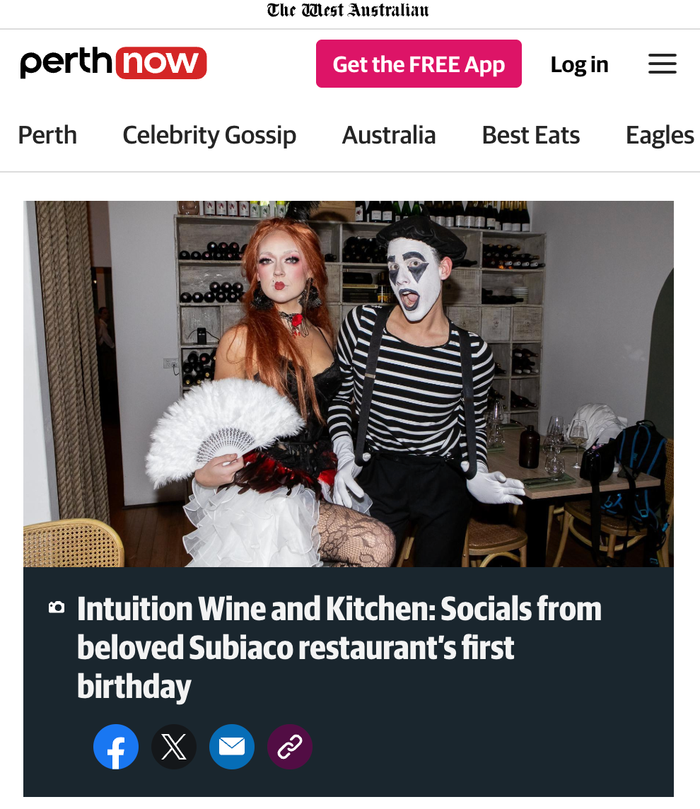 Two people in costumes posing for a photo on a website homepage.